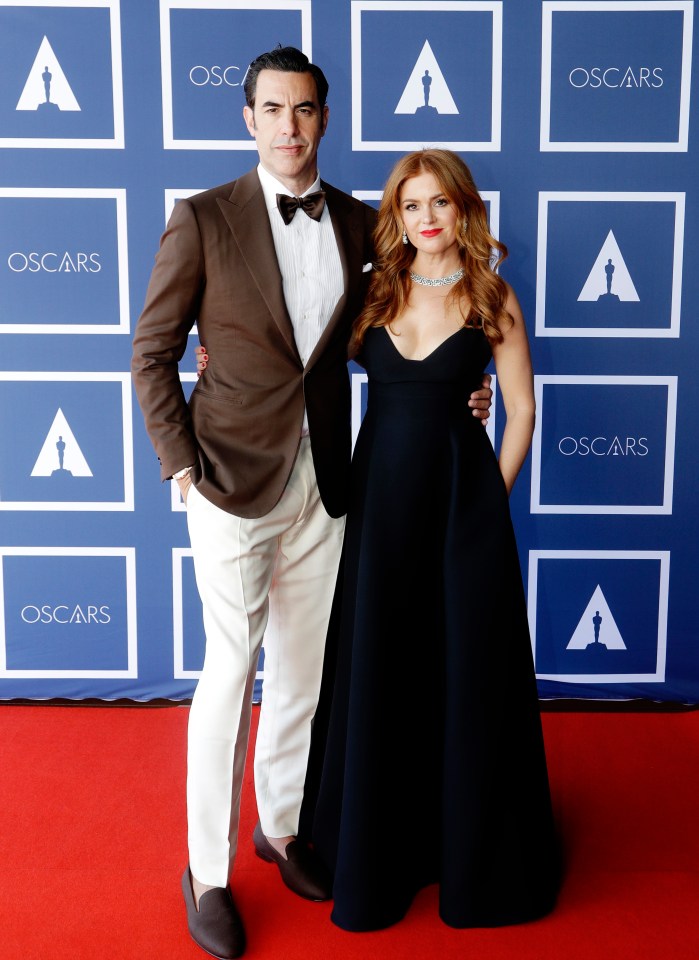 Sacha Baron Cohen and Isla Fisher at an Oscars screening.
