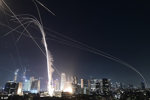 Israelis rushed to bomb shelters as air raid sirens rang out tonight, with the Israeli military confirming their 'defence systems are working to intercept the threat'