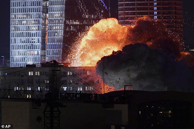 A missile was seen exploding into a building in Tel Aviv after Iran launched a salvo of missiles against Israel