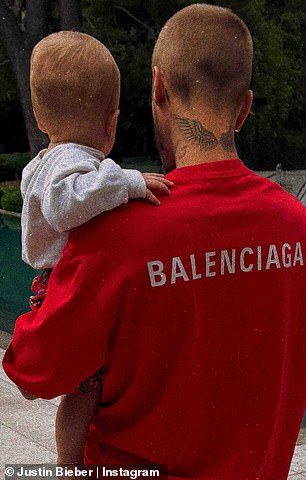The baby donned patterned red shorts