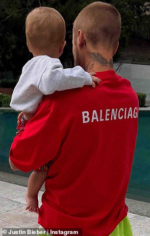 The father-son duo were dressed in color-coordinated outfits, with the Yummy hitmaker clad in a baggy red Balenciaga T-shirt