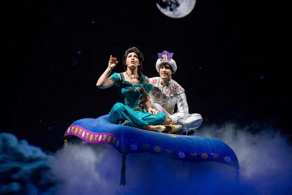 Aladdin and Jasmine on a magic carpet.