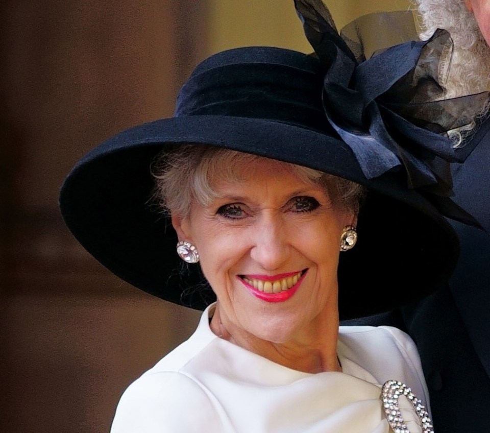 Sir Brian May and Anita Dobson at Buckingham Palace after receiving honors.