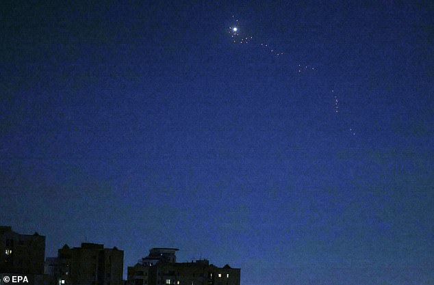 Iranian air defense system glows over central Tehran, Iran as Israel launches air strikes