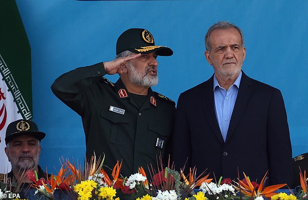 Iranian President Masoud Pezeshkian (R) and Commander of the Islamic Revolutionary Guard Corps' Aerospace Force Amir Ali Hajizadeh (C) in September 2024