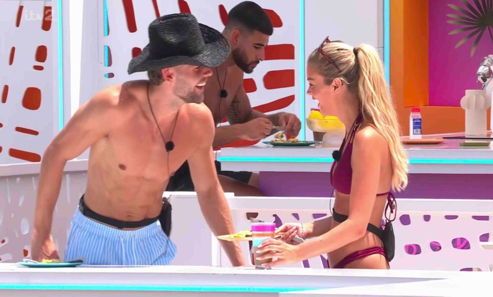 Two contestants on Love Island sharing a meal.