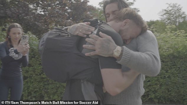 Pete and Sam immediately embrace with a hug, before the runner breaks down in tears in his podcast co-host's arms