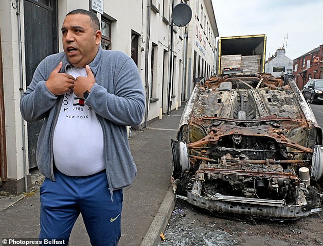 Kolyo and his wife Minka returned to their home to pick up possessions after it was ransacked on Tuesday night and her neighbour's car set on fire