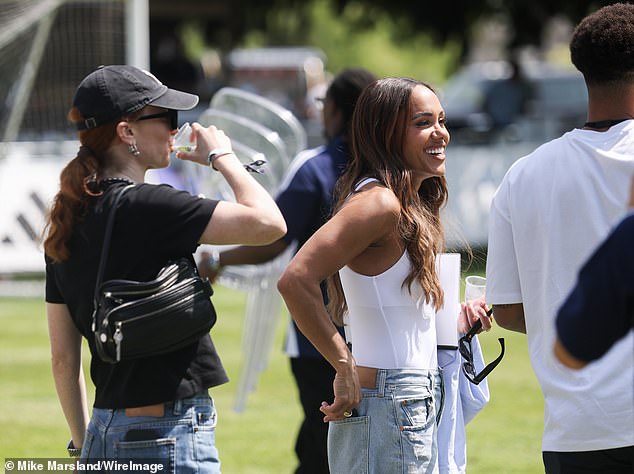 The pair looked in good spirits as they chatted with the players on the pitch