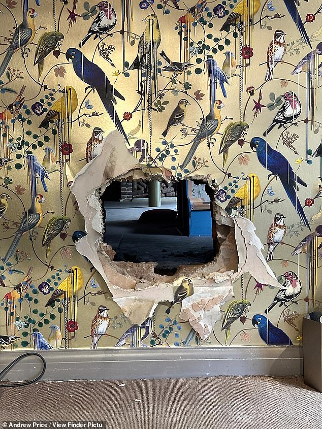 The hole the thieves drilled to access the store during their well-planned burglary