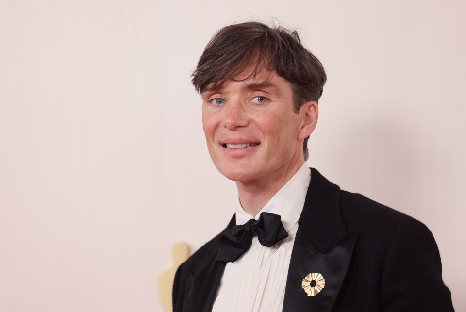 Cillian Murphy in a tuxedo, smiling.