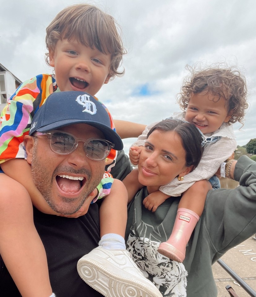 Family portrait of Ryan Thomas, Lucy Mecklenburgh, and their two children.