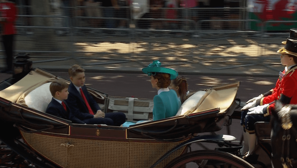 Screenshot of a horse-drawn carriage carrying Kate Middleton and her children.