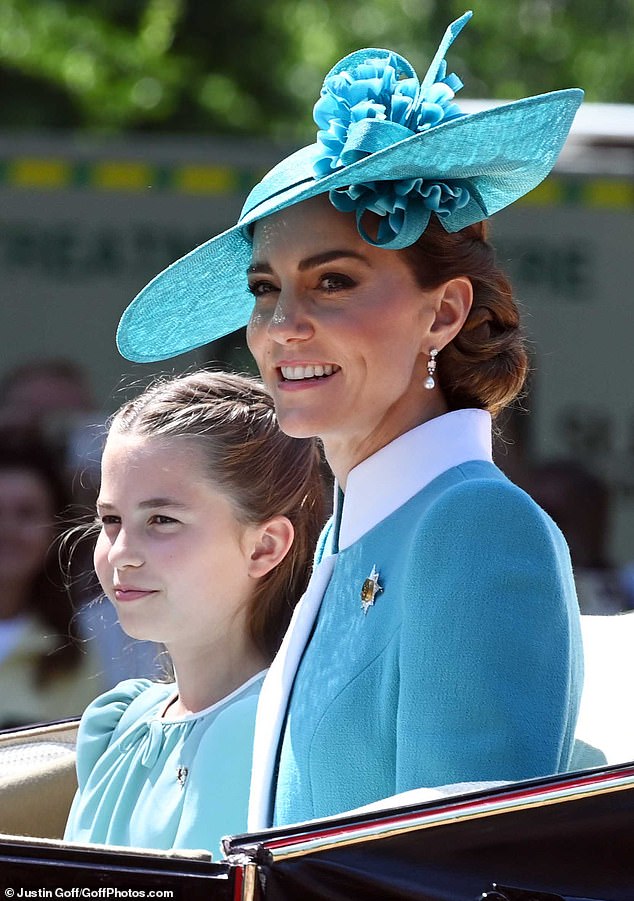 Charlotte took after her mother as they wore matching blue dresses, with Kate picking a blue coat dress from Catherine Walker - complete with a wide-brimmed hat by Juliette Botterill - for today's Trooping the Colour