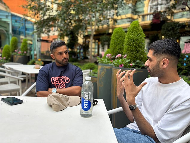Mail Sport's Aadam Patel (right) sits alongside Nair (left) in the courtyard of the Taj Hotel, which the Indian cricketer associates with the end of his international career