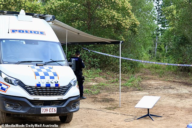 Police are seen at a cordoned-off section of Good Night Scrub National Park on Saturday