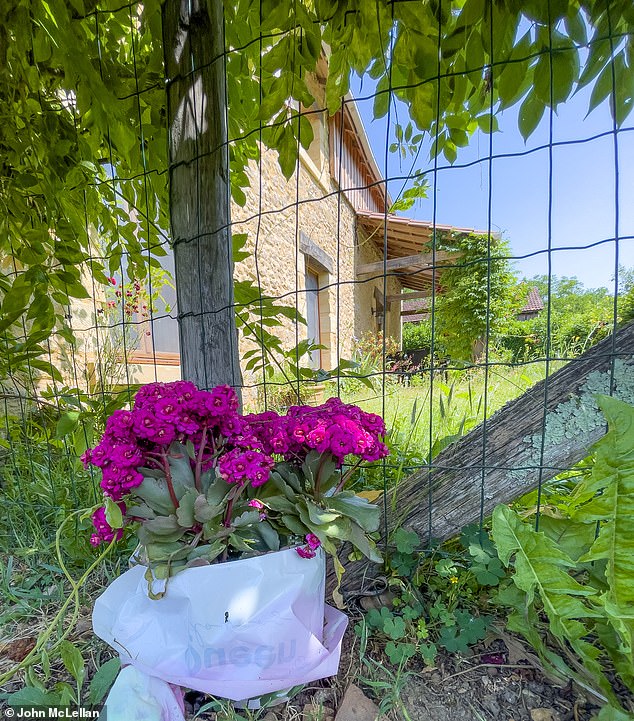Floral tributes have been left for Karen Carter outside her cottage in the Dordogne