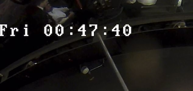The father is seen stood behind the waiter