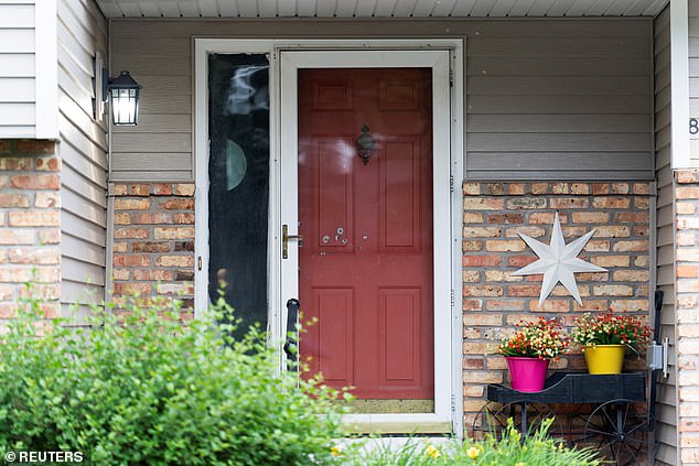 According to the Hoffmans' nephew, Mat Ollig, the couple will be bound to the hospital 'for a while,' The New York Times reported (pictured: bullet holes in the Hoffmans' front door)