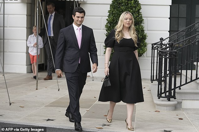 Tiffany Trump (right) departs the White House Saturday night alongside her husband Michael Boulos (right). The couple's first child was born last month