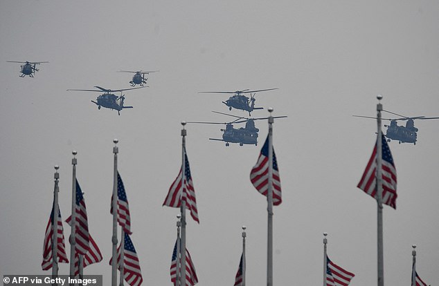 A batch of Chinook helicopters fly over the National Mall during Saturday's 250th Army anniversary parade