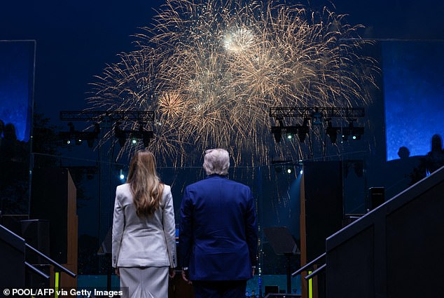 First lady Melania Trump (left) and President Donald Trump (right) watch the fireworks display at the conclusion of Saturday's 250th Army anniversary parade