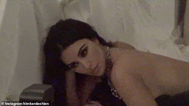 Kim stripped off while posing seductively in a hotel room and showing off her famous hourglass figure