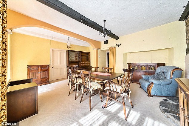 The dining hall provides access to the kitchen, inner hallway, and a spacious lounge