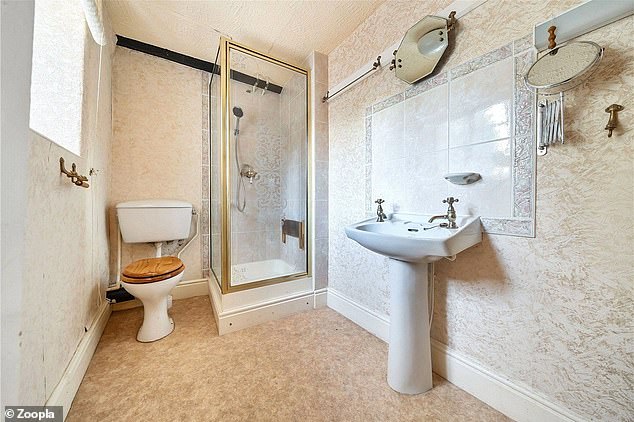 The smaller bathroom with a shower, which could be turned into an ensuite