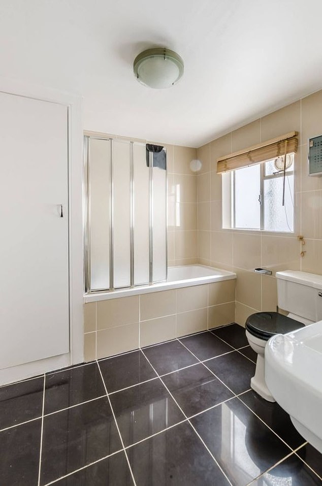 A modern bathroom with a bath and shower in the London property