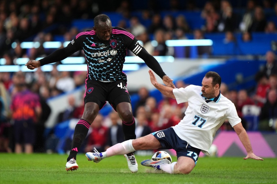 World XI's Usain Bolt (left) is challenged by England's Danny Dyer during Soccer Aid for UNICEF 2024 at Stamford Bridge, London. Picture date: Sunday June 9, 2024. PA Photo. See PA Story SPORT Soccer Aid. Photo credit should read: Bradley Collyer/PA Wire. RESTRICTIONS: Use subject to restrictions. Editorial use only, no commercial use without prior consent from rights holder.