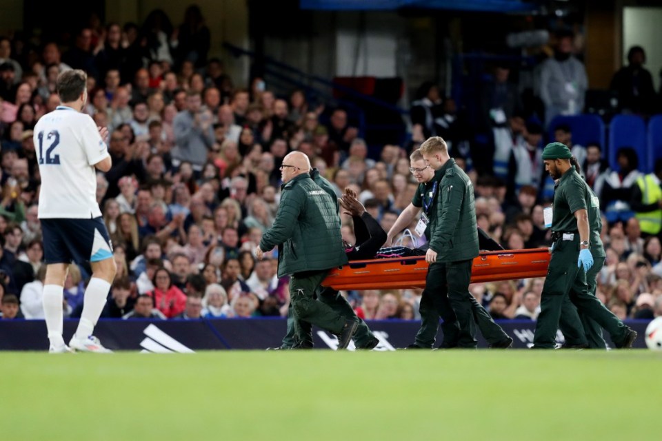 LONDON, ENGLAND - JUNE 09: Usain Bolt of World XI is carried off on a stretcher following an injury during Soccer Aid for UNICEF 2024 at Stamford Bridge on June 09, 2024 in London, England. (Photo by Henry Browne/Getty Images)