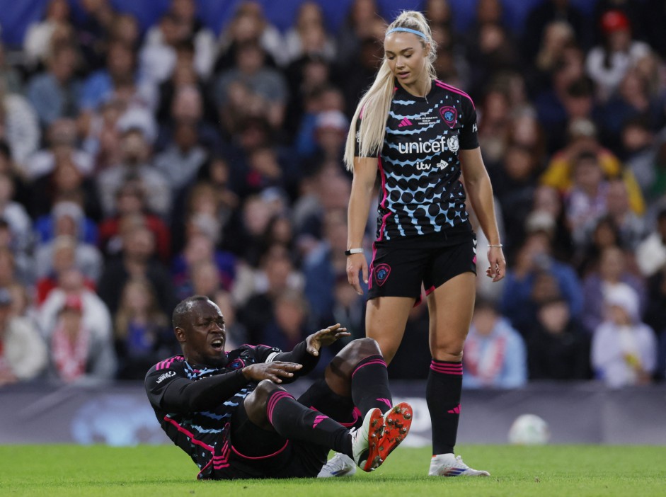 Soccer Football - Soccer Aid for UNICEF - England v Soccer Aid World XI - Stamford Bridge, London, Britain - June 9, 2024 Soccer Aid World XI's Usain Bolt reacts after sustaining an injury Action Images via Reuters/Andrew Couldridge