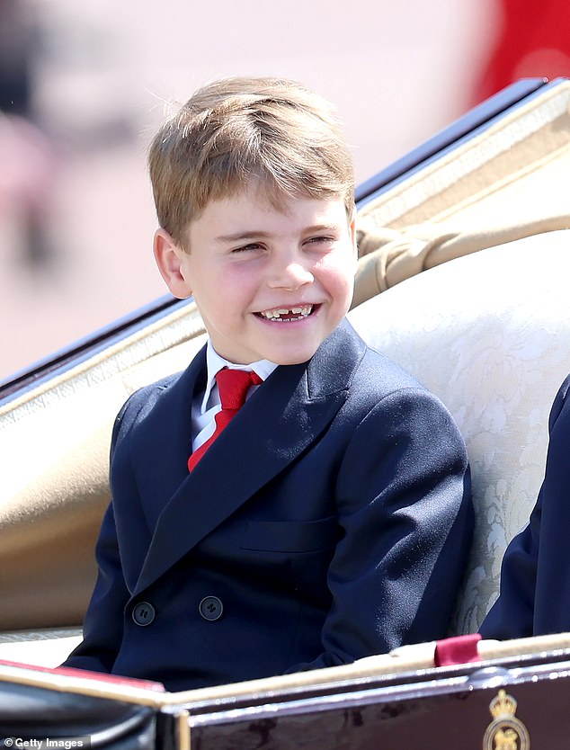 Prince Louis, the spirited third child of the Prince and Princess of Wales, is pictured flashing a grin during Trooping the Colour on Saturday