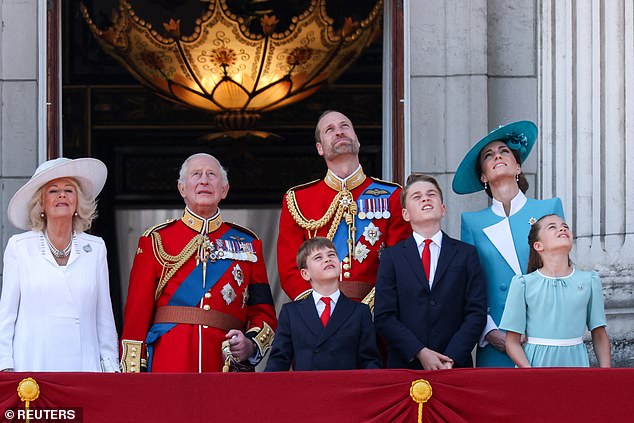 From left to right: Queen Camilla, King Charles, Prince William, Princess Catherine and the three Wales children enjoy the flypast