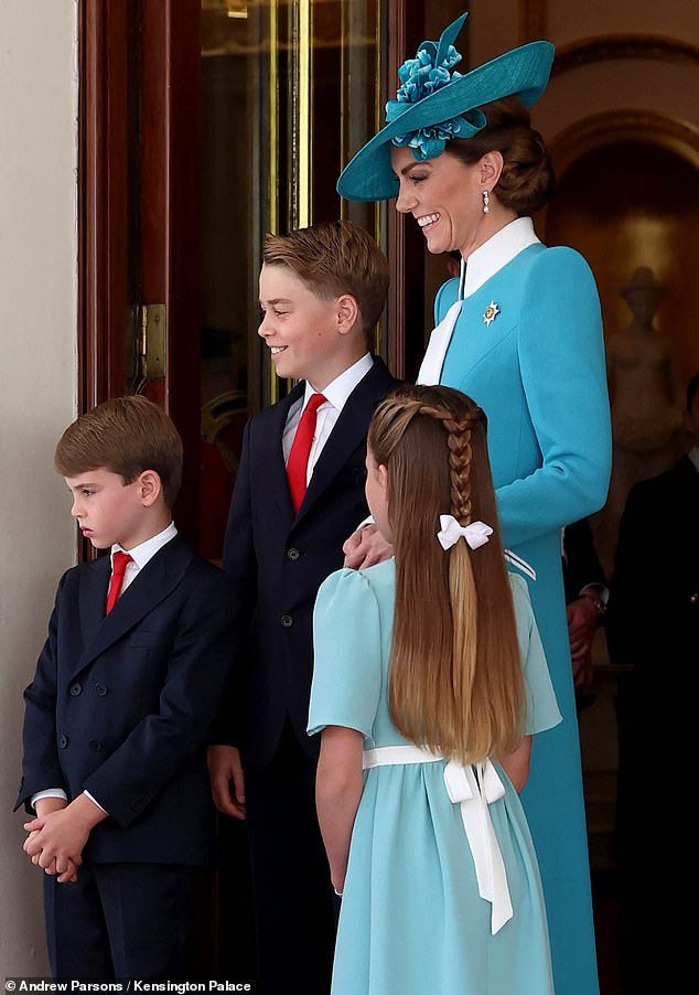 Kate and her brood! Prince Louis looks grumpy as Prince George and Princess Catherine flash beaming smiles while Princess Charlotte, with her hair in an elegant style, watches on