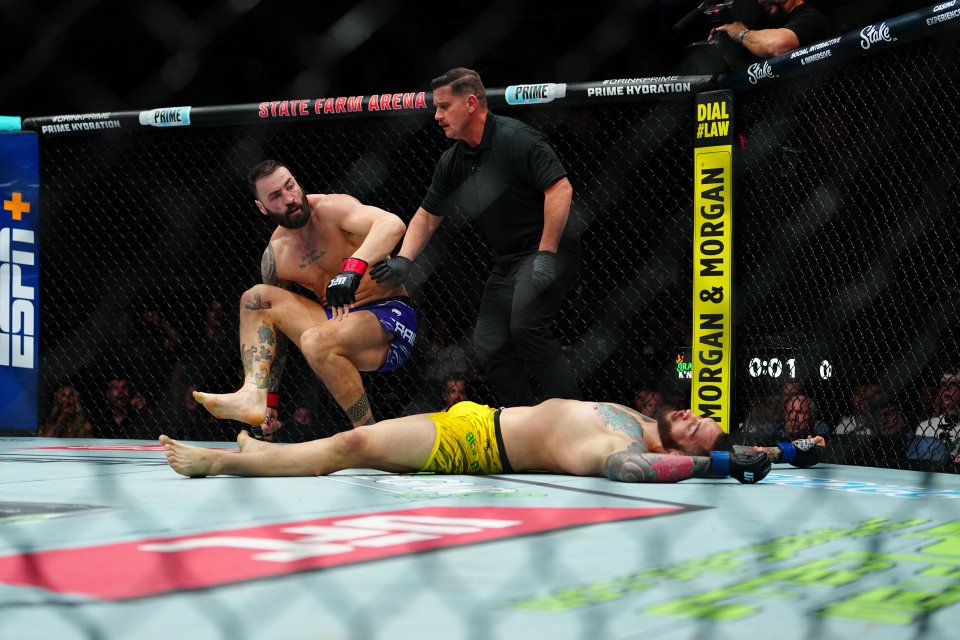 Paul Craig standing over a downed Rodolfo Bellato in a UFC match.