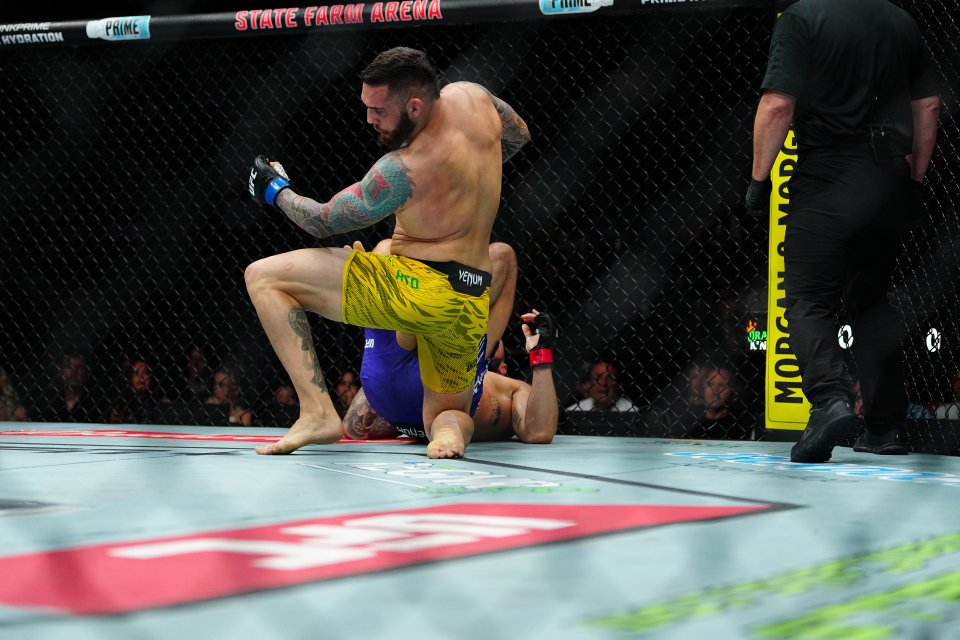 Paul Craig and Rodolfo Bellato fighting in a UFC match at State Farm Arena.