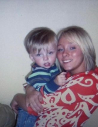 A woman holding a young boy.