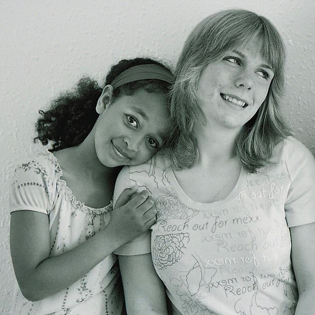 Half-sisters Misti and Chloe pose for a cute photo while they were growing up