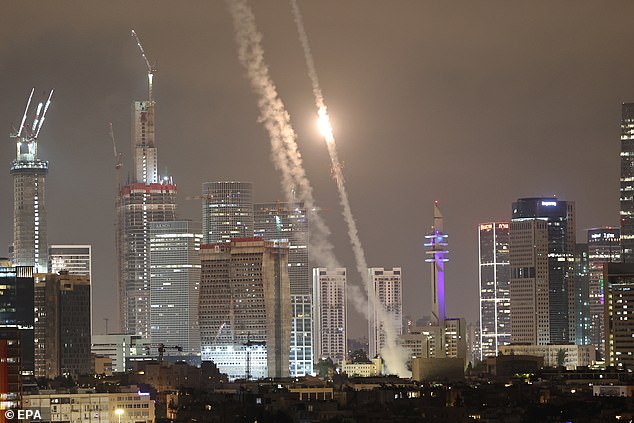 Israel's Iron Dome air defense system intercepts ballistic missiles fired from Iran over the city of Tel Aviv, Israel, 15 June 2025