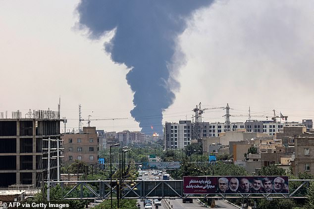 Smoke rises from a oil refinery in southern Tehran today