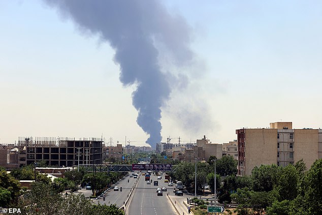 Smoke from an oil refinery rises over residential buildings in southern Tehran, Iran, 15 June 2025. Israel continued to target sites related to Iran's nuclear program and energy facilities, after launching strikes across Iran since 13 June. In retaliation, Iran launched waves of missiles and drones toward Israel