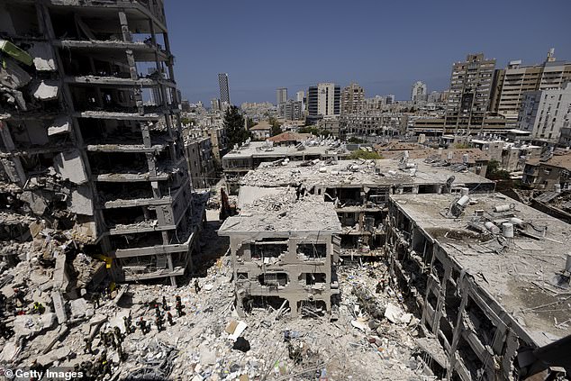 Emergency and Rescue soldiers search for trapped people inside heavily damaged buildings after an overnight missiles strike from Iran on June 15, 2025 in Bat Yam, Israel. Iran launched a retaliatory missile strike on Israel starting late on June 13, after a series of Israeli airstrikes earlier in the day targeted Iranian military and nuclear sites, as well as top military officials