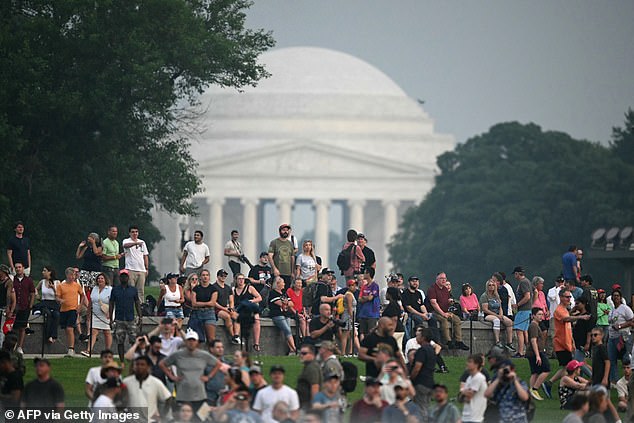 People watch the Army 250th Anniversary Parade in Washington, DC, on June 14, 2025