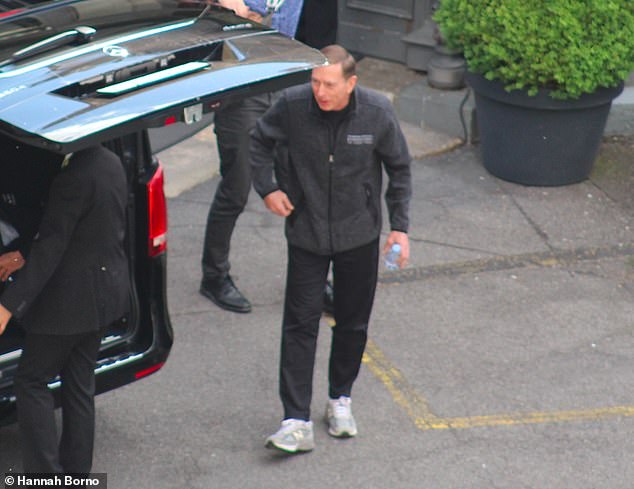 The former US Army general and CIA boss turned Wall Street financier, David Petraeus, arrives at the 2019 meeting after a long-haul flight in comfortable travel wear