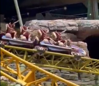 Roller coaster cars on a track.
