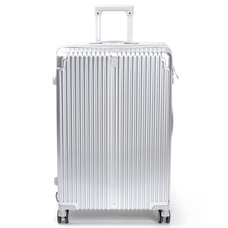Silver suitcase with wheels and handle.