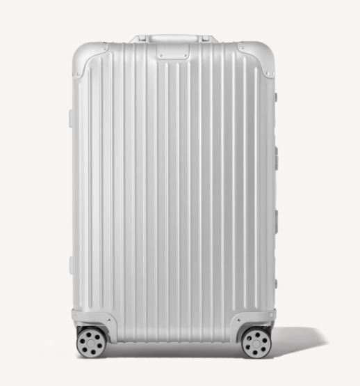 Silver suitcase with wheels.