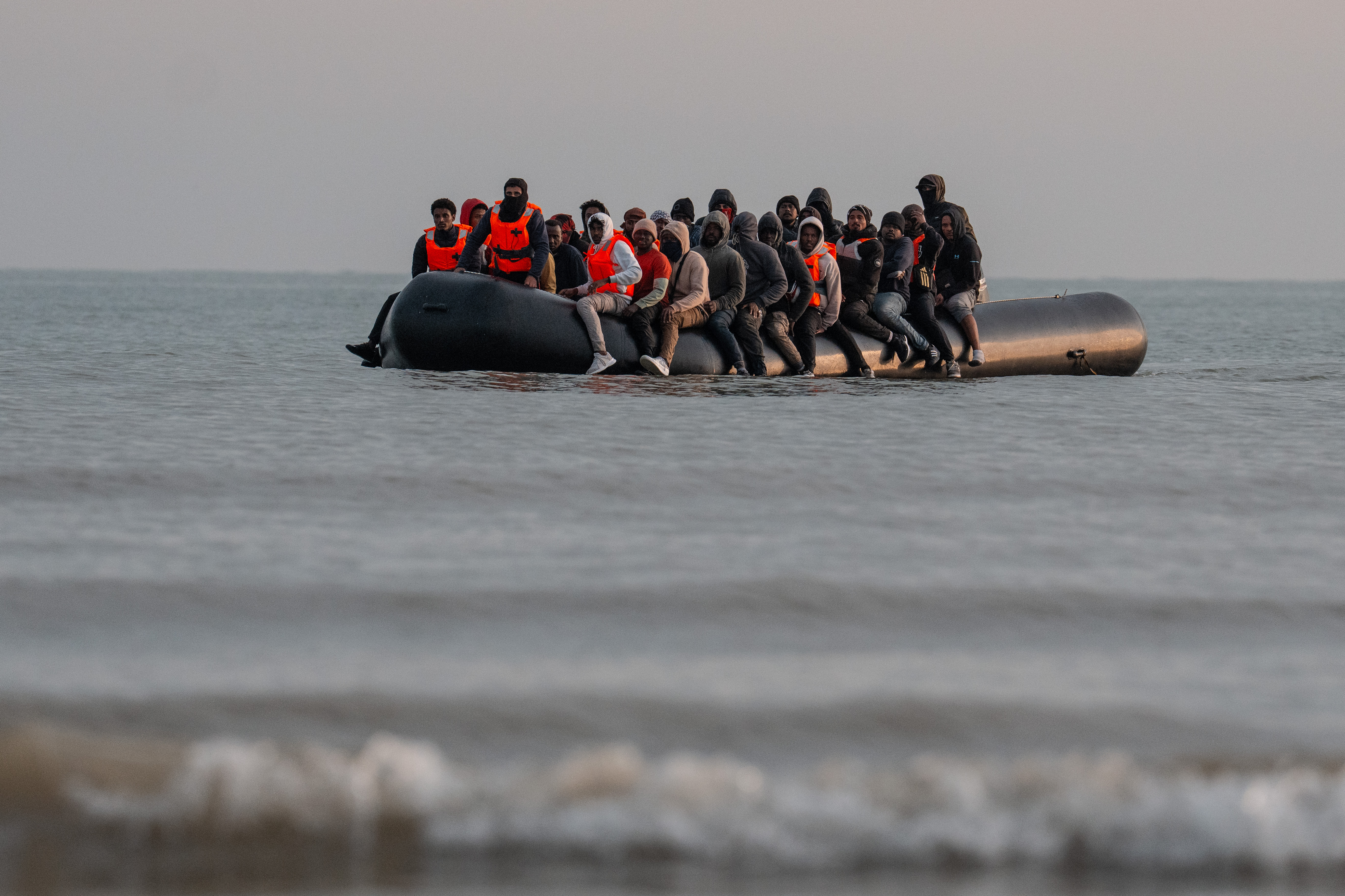 Migrants in a small boat crossing the English Channel.